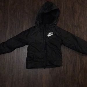 A kids black nike jacket